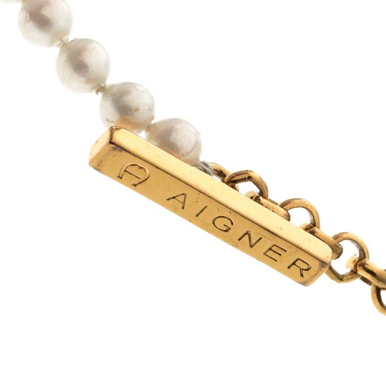 Pre Owned Aigner Faux Pearl Crystal Gold Tone Toggle Bracelet