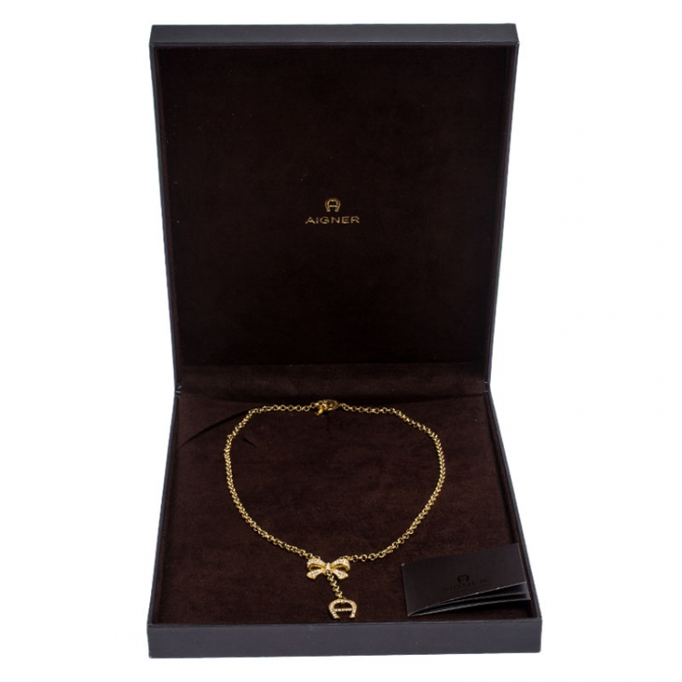 Pre Owned Aigner Crystal Studded Bow Gold Tone Long Toggle Necklace 