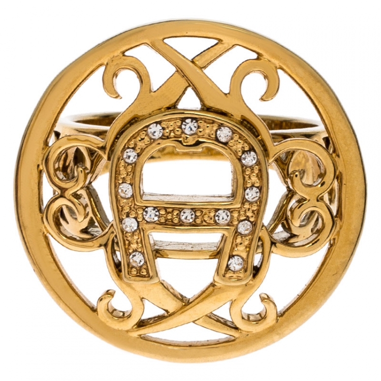 Pre Owned Aigner Gold Tone Crystal Embellished Logo Ring Size 56