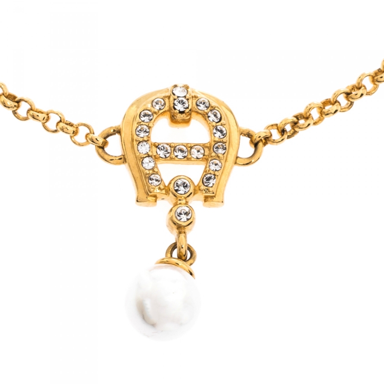 Pre Owned Aigner Crystal Faux Pearl Gold Tone Charm Bracelet