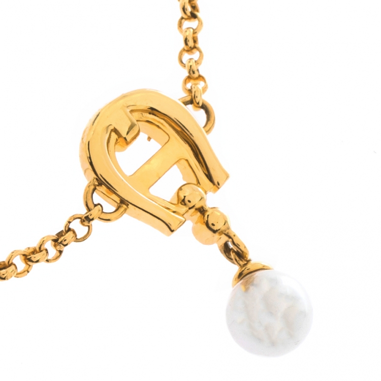 Pre Owned Aigner Crystal Faux Pearl Gold Tone Charm Bracelet