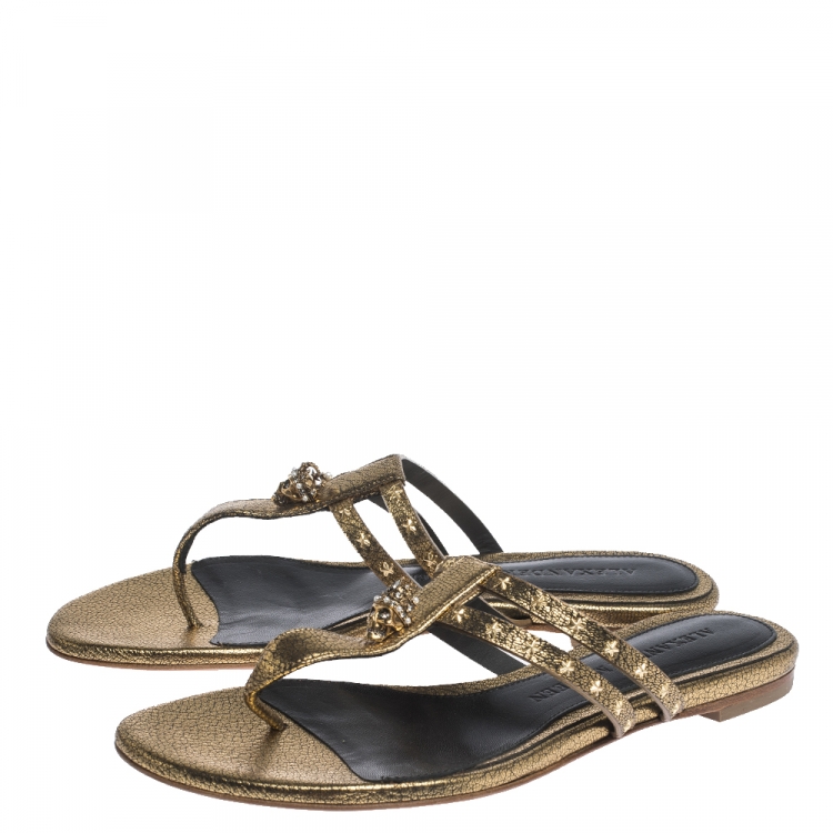 Pre Owned Alexander McQueen Metallic Gold Leather Embellished Skull Flat Thong Sandals Size 37