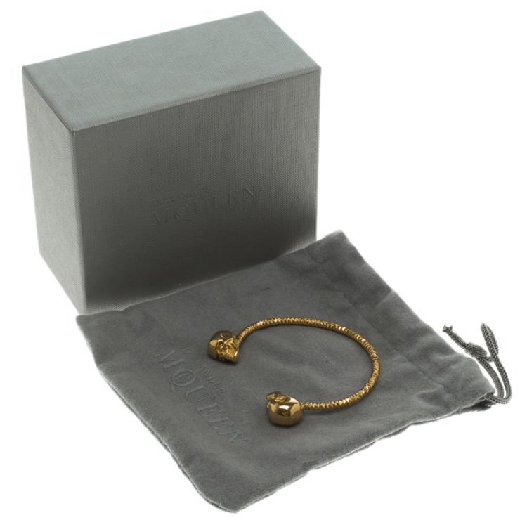 Pre Owned Alexander McQueen Twin Skull Gold Tone Open Cuff Bracelet 19cm