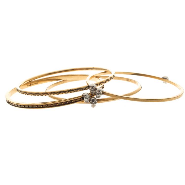 Pre Owned Alexander McQueen Armour Skull Gold Tone Set of 4 Bangles One Size