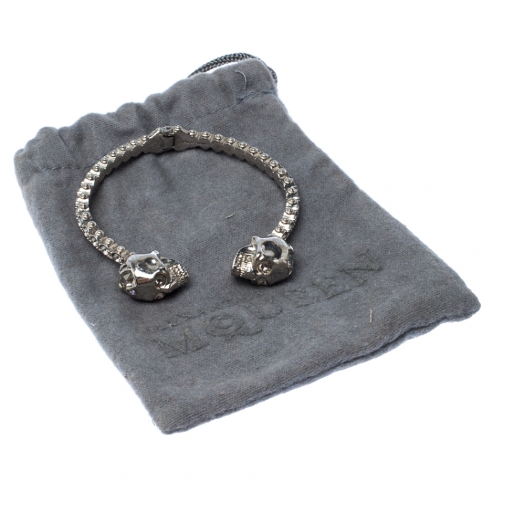 Pre Owned Alexander McQueen Twin Crystal Embedded Skull Silver Tone Open Cuff Bracelet
