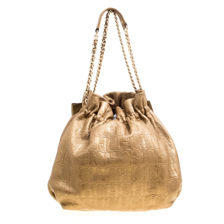 Pre Owned Carolina Herrera Gold Monogram Embossed Leather Bow Bucket Hobo