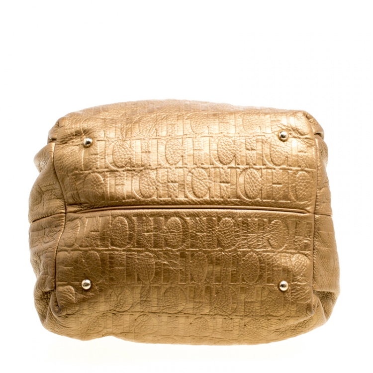 Pre Owned Carolina Herrera Gold Monogram Embossed Leather Bow Bucket Hobo