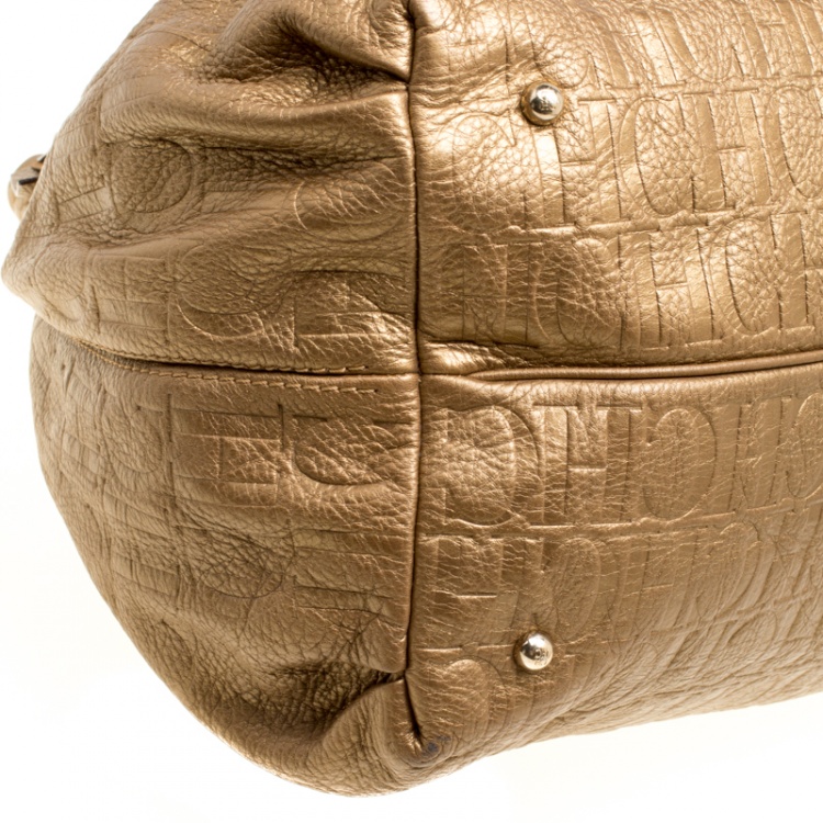 Pre Owned Carolina Herrera Gold Monogram Embossed Leather Bow Bucket Hobo