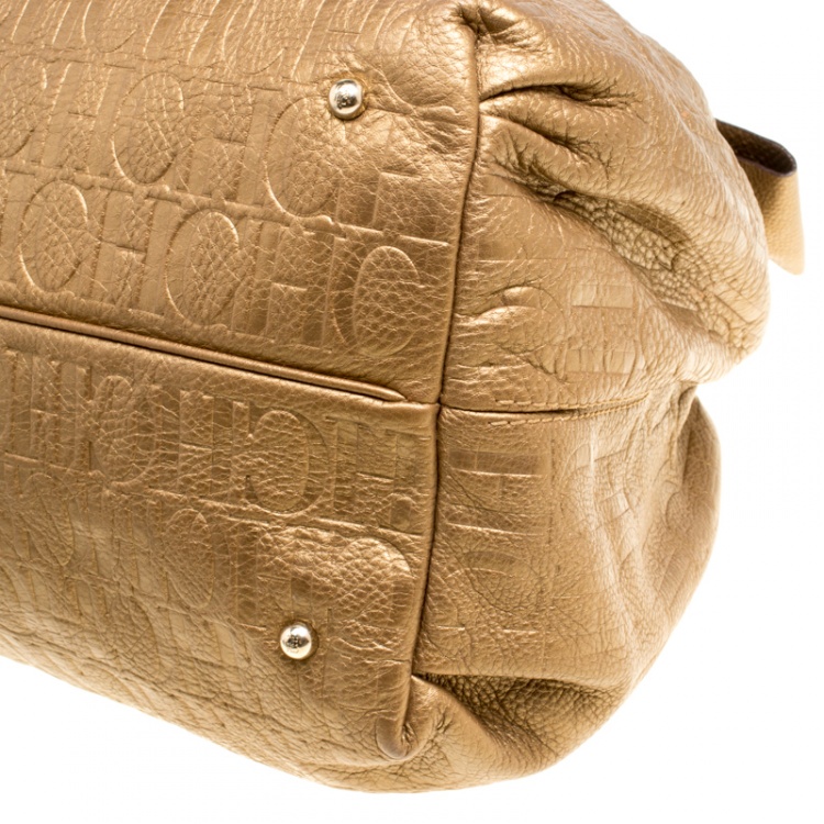 Pre Owned Carolina Herrera Gold Monogram Embossed Leather Bow Bucket Hobo