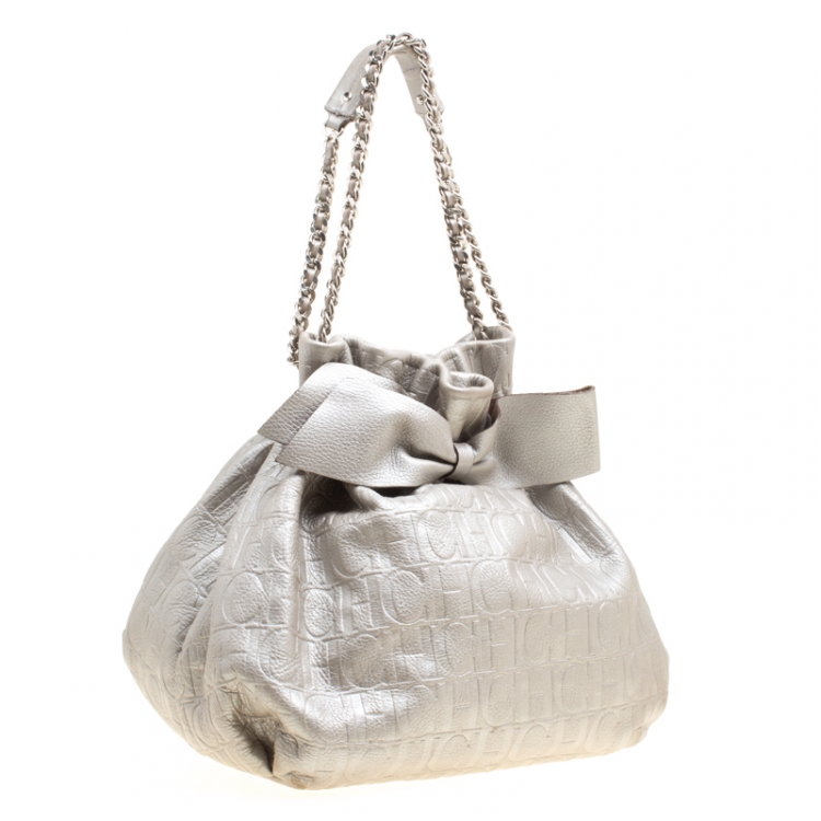 Pre Owned Carolina Herrera Silver Monogram Embossed Leather Bow Bucket Shoulder Bag