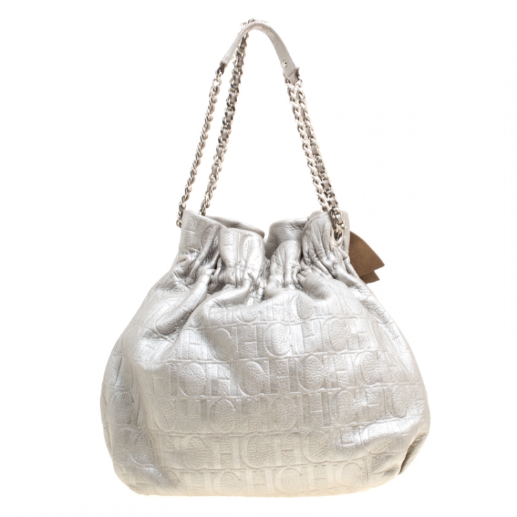 Pre Owned Carolina Herrera Silver Monogram Embossed Leather Bow Bucket Shoulder Bag