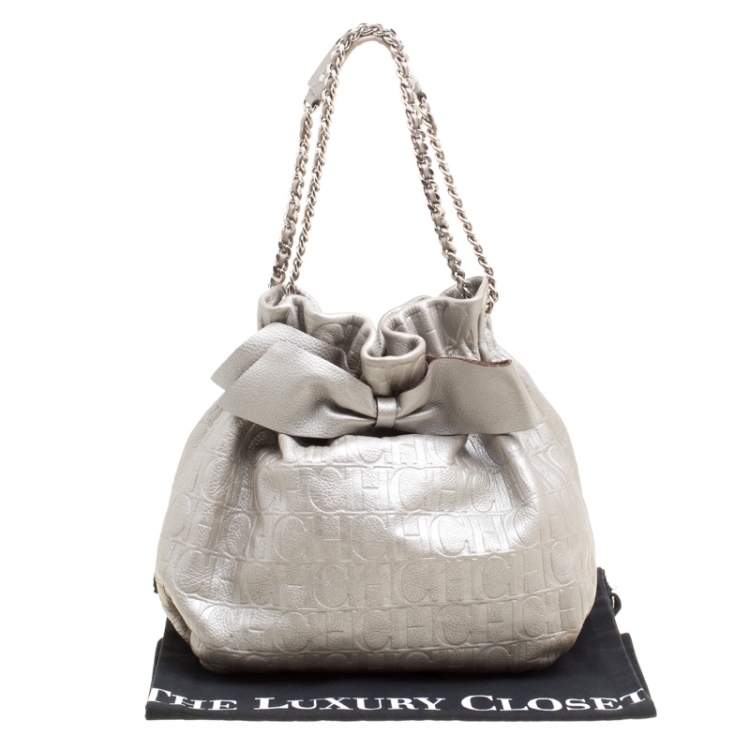 Pre Owned Carolina Herrera Silver Monogram Embossed Leather Bow Bucket Shoulder Bag