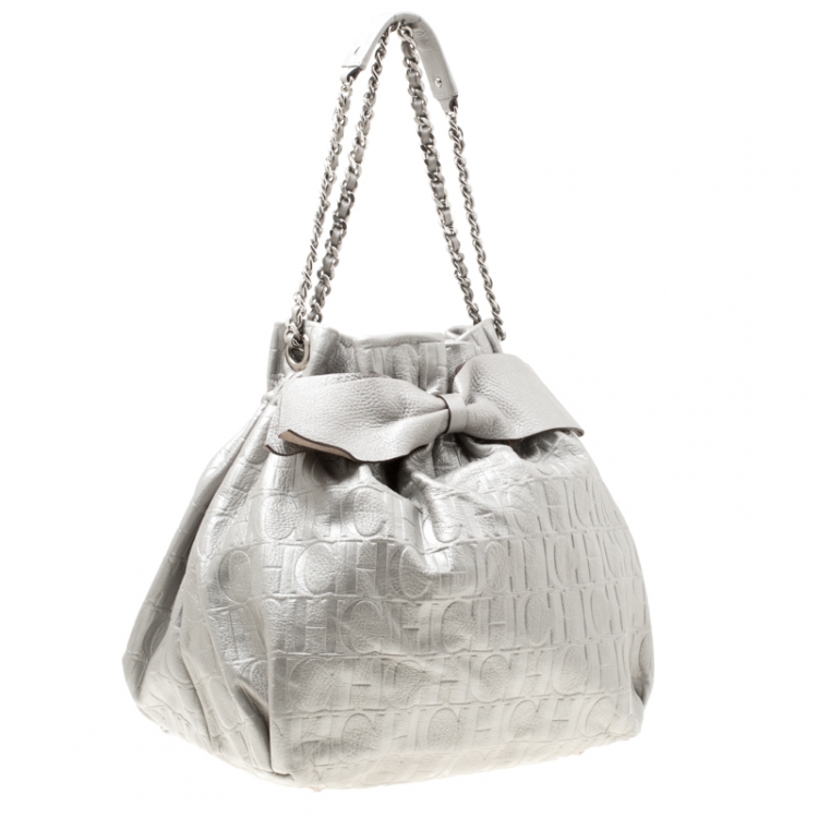 Pre Owned Carolina Herrera Silver Monogram Leather Bow Bucket Hobo