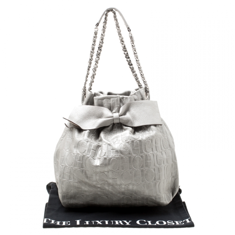 Pre Owned Carolina Herrera Silver Monogram Leather Bow Bucket Hobo