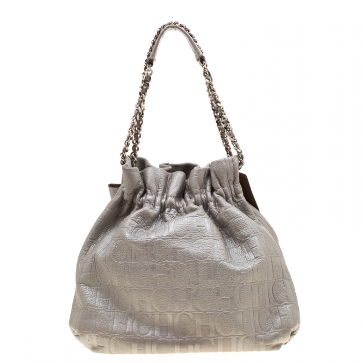Pre Owned Carolina Herrera Silver Monogram Embossed Leather Bow Bucket Shoulder Bag
