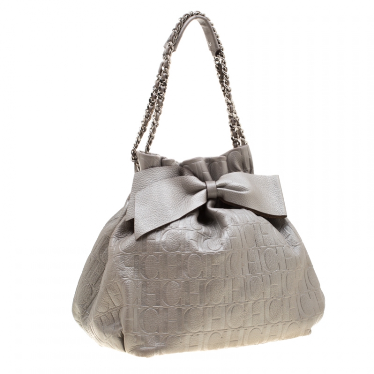 Pre Owned Carolina Herrera Silver Monogram Embossed Leather Bow Bucket Shoulder Bag
