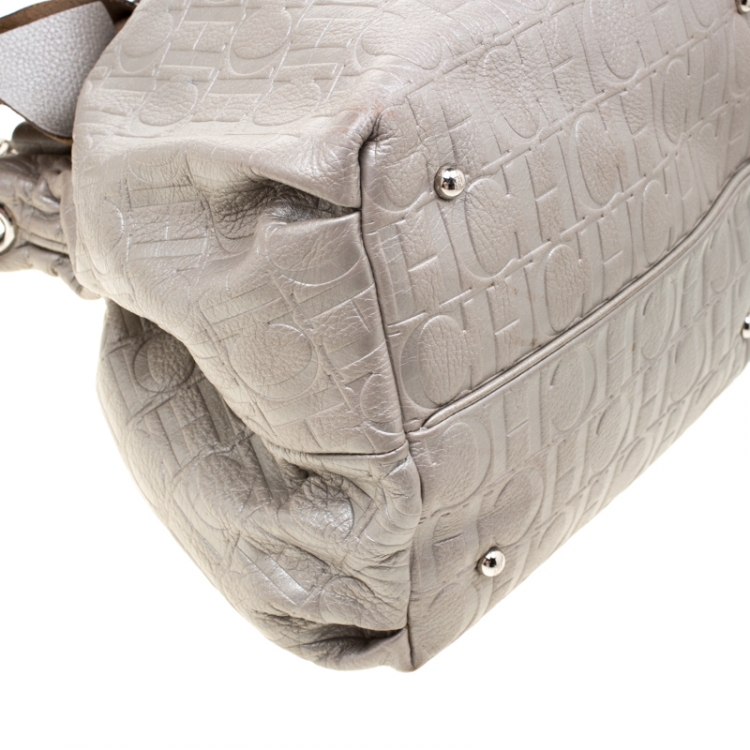 Pre Owned Carolina Herrera Silver Monogram Embossed Leather Bow Bucket Shoulder Bag