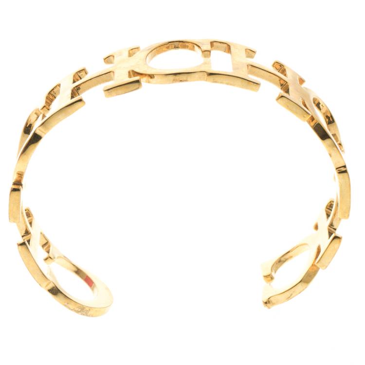 Pre Owned Carolina Herrera CH Gold Tone Wide Open Cuff Bracelet 18cm