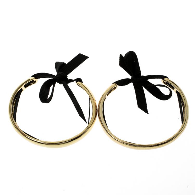 Pre Owned CH Carolina Herrera Gold Tone Ribbon Tie-up Pair of Open Cuff Bracelet