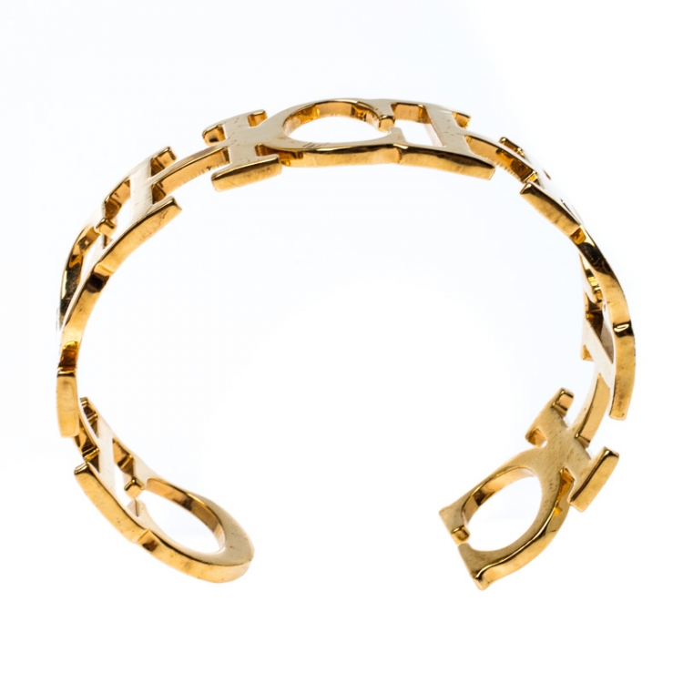 Pre Owned CH Carolina Herrera Logo Gold Tone Open Cuff Bracelet