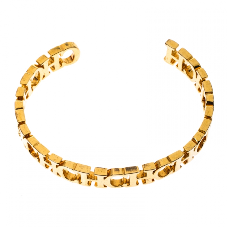 Pre Owned CH Carolina Herrera Logo Gold Tone Open Cuff Bracelet