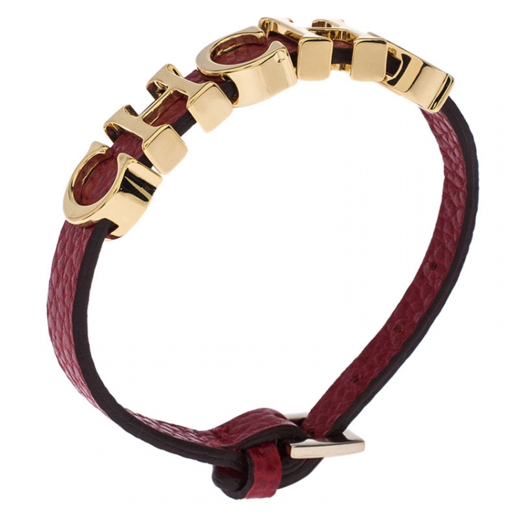 Pre Owned CH Carolina Herrera Red Leather Gold Tone Logo Charm Bracelet