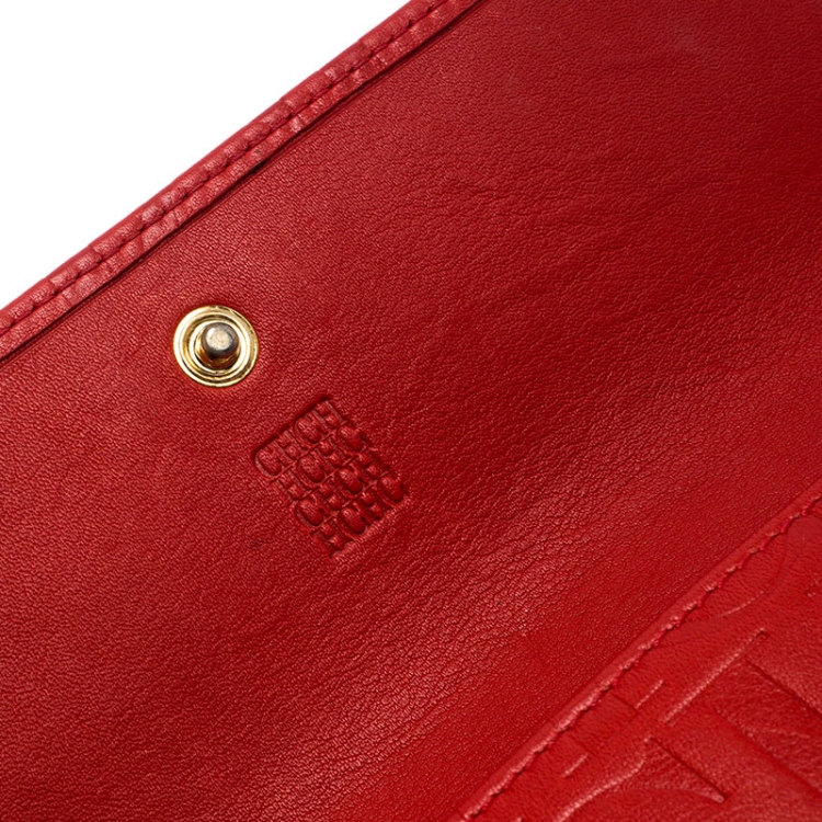 Pre Owned Carolina Herrera Red Monogram Embossed Leather Flap Continental Wallet