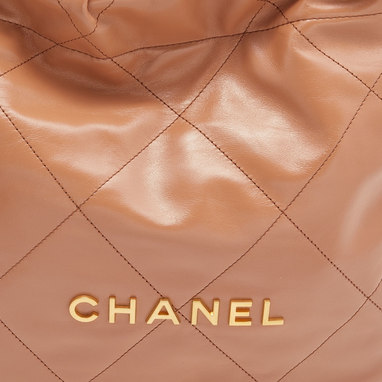 Pre Owned Chanel Tan Quilted Glossy Leather Drawstring 22 Bag