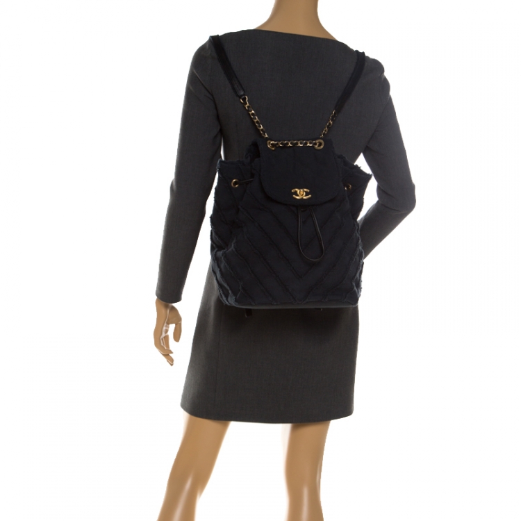 Pre Owned Chanel Navy Blue  Chevron Denim Medium Drawstring Patchwork Backpack                        