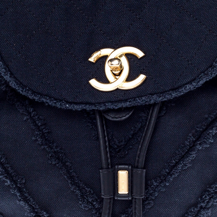 Pre Owned Chanel Navy Blue  Chevron Denim Medium Drawstring Patchwork Backpack                        
