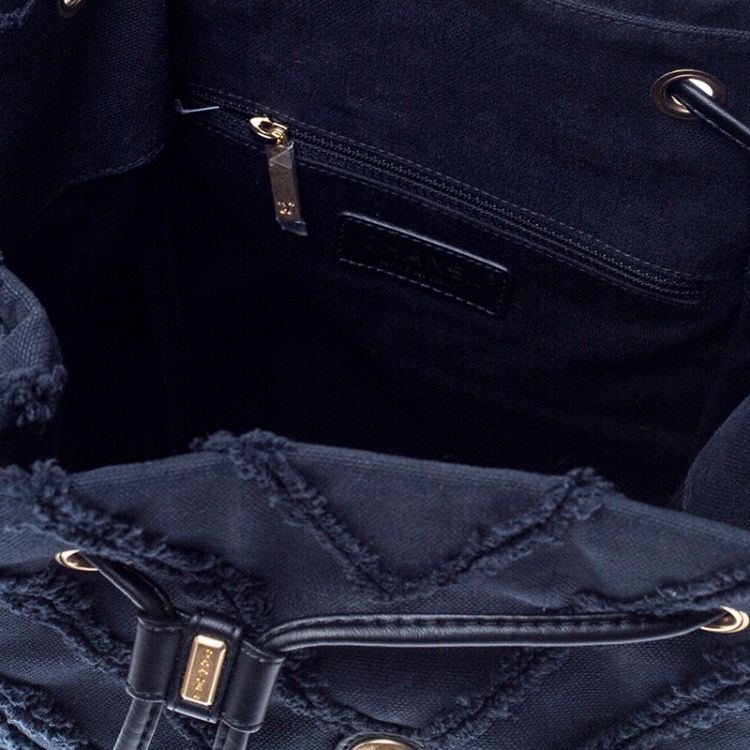 Pre Owned Chanel Navy Blue  Chevron Denim Medium Drawstring Patchwork Backpack                        