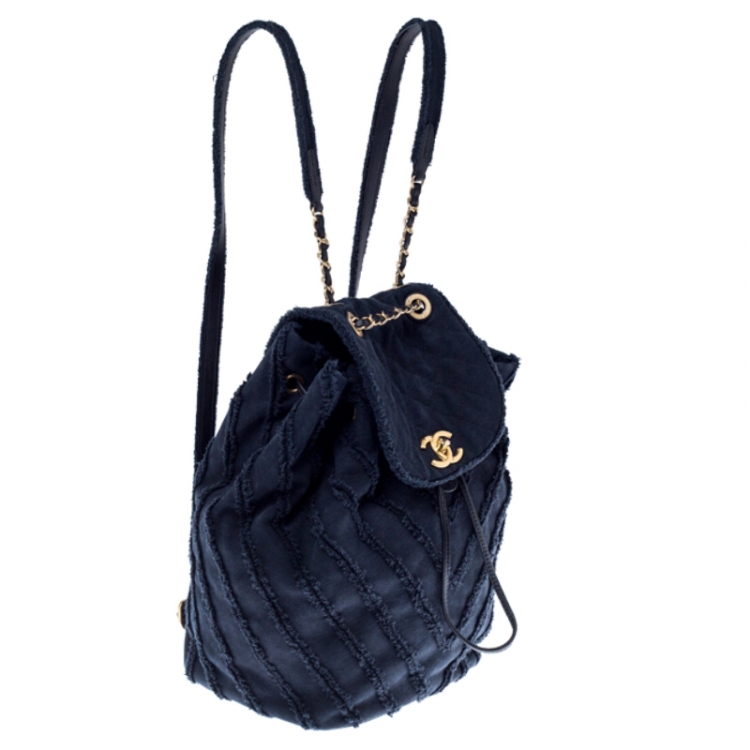 Pre Owned Chanel Navy Blue  Chevron Denim Medium Drawstring Patchwork Backpack                        