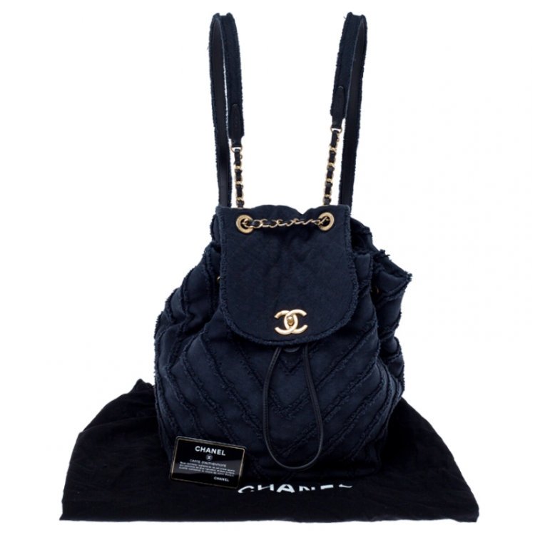 Pre Owned Chanel Navy Blue  Chevron Denim Medium Drawstring Patchwork Backpack                        