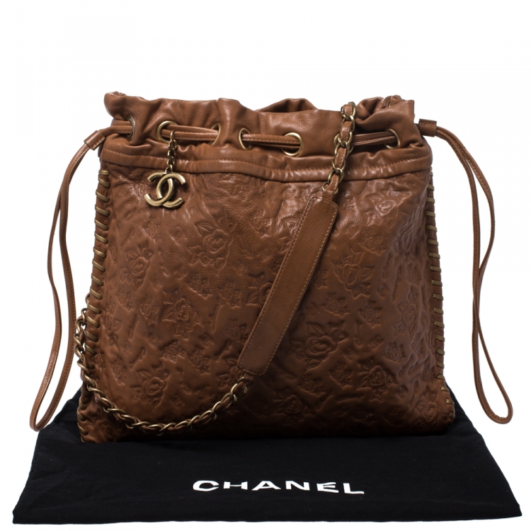 Pre Owned Chanel Brown Floral Embossed Leather Drawstring Bag