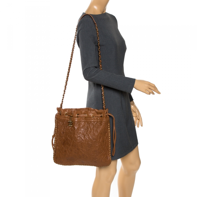 Pre Owned Chanel Brown Floral Embossed Leather Drawstring Bag