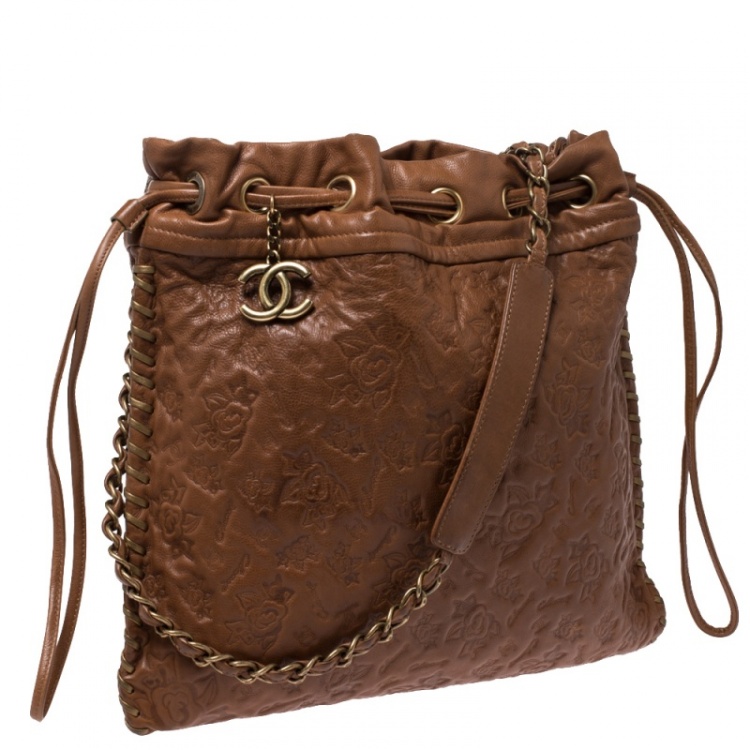Pre Owned Chanel Brown Floral Embossed Leather Drawstring Bag