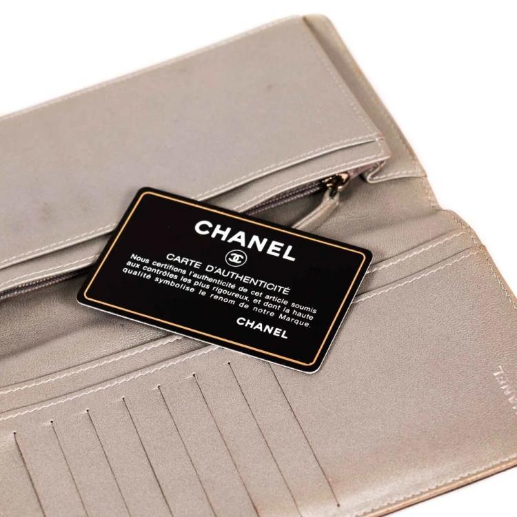Pre Owned Chanel Black Embossed Leather Camellia Bifold Flap Wallet
