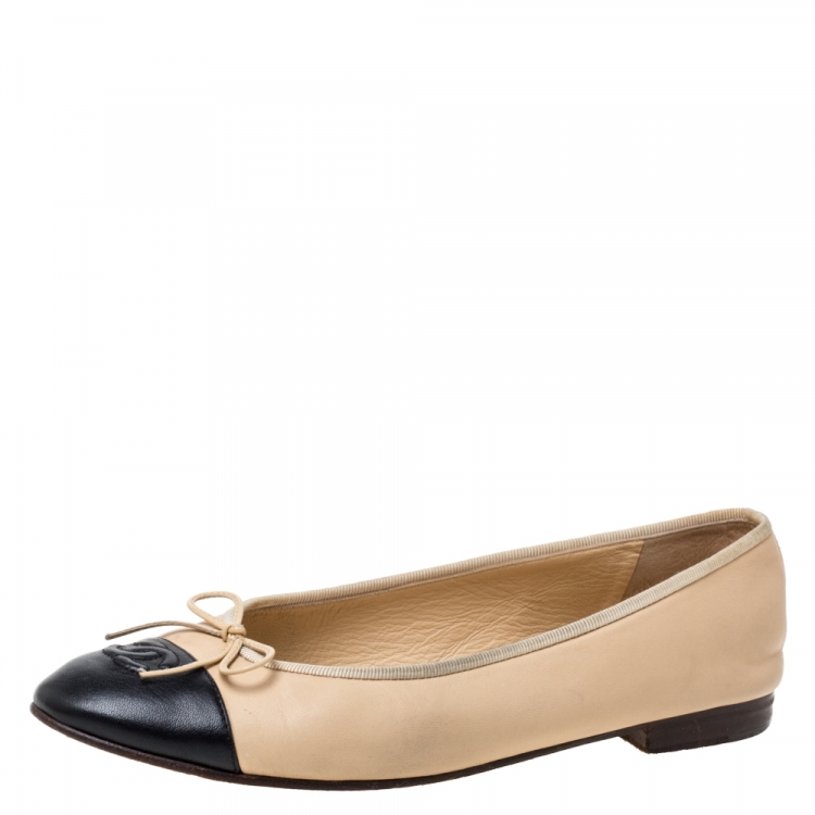 tan and black cap toe flats