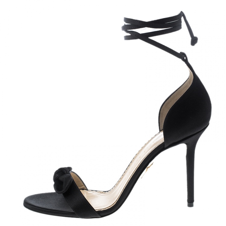 مملوكة مسبقًا Charlotte Olympia Black Satin Shelley Bow Embellished Ankle Wrap Sandals Size 38.5