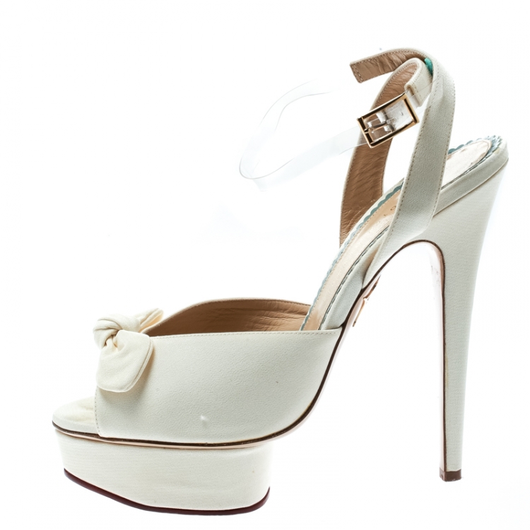 مملوكة مسبقًا Charlotte Olympia Cream Satin Serena Bow Ankle Strap Platform Sandals Size 41