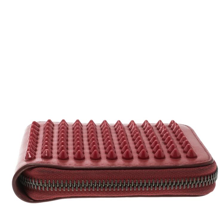 مملوكة مسبقًا Christian Louboutin Red Leather Spiked Zip Around Wallet