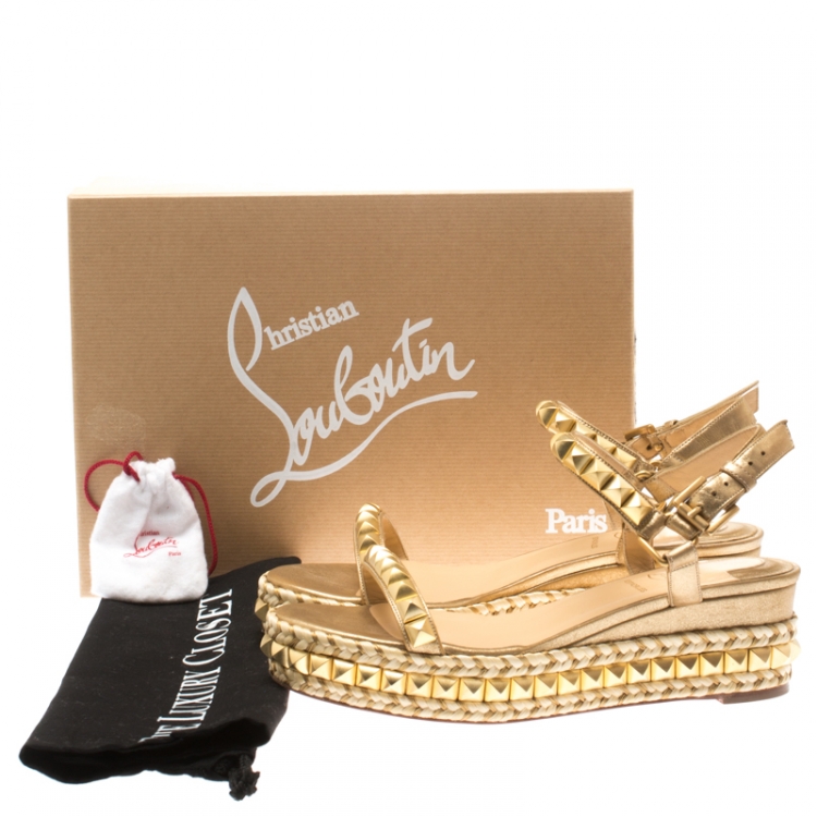 gold studded louboutins