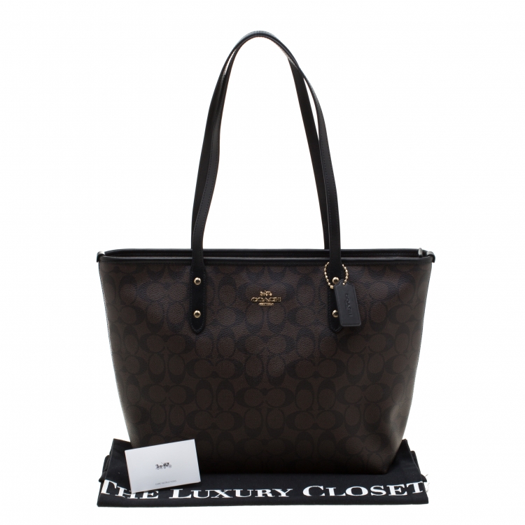 Pre Owned Coach Brown/Black Signature Coated Canvas City Zip Tote