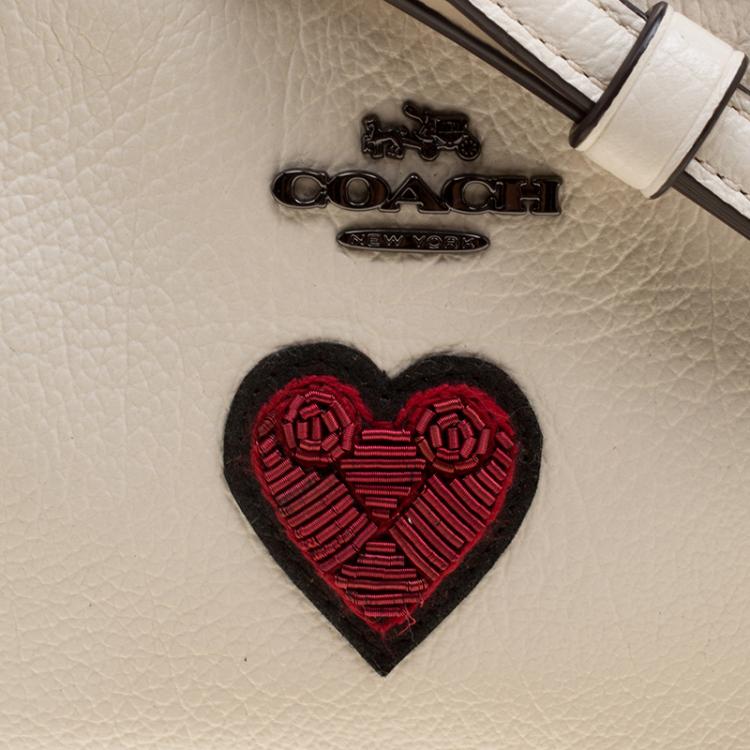 Pre Owned Coach Cream Leather Heart Embroidered Oval Crossbody Clutch Bag