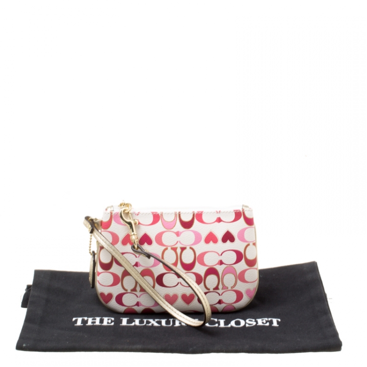 Pre Owned Coach White/Pink Heart Printed Coated Canvas Poppy Wristlet Clutch