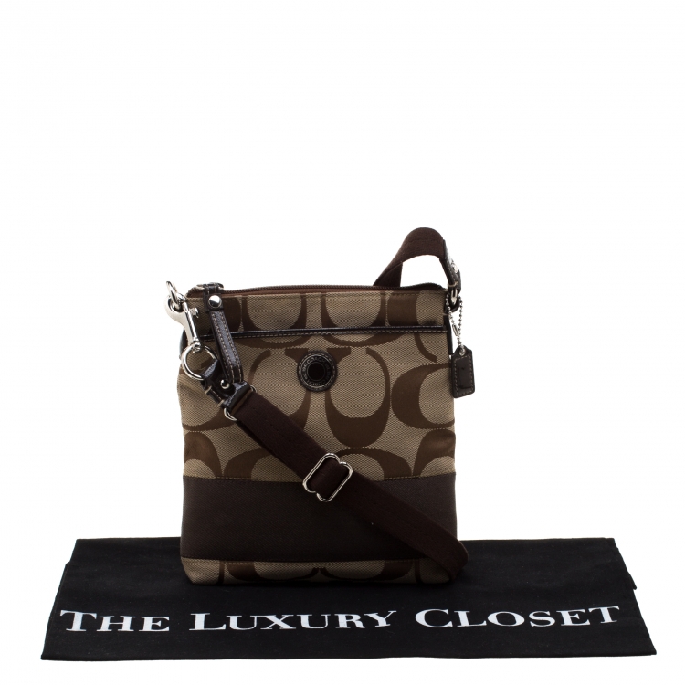 Pre Owned Coach Brown/Beige Signature Canvas Swingpack Crossbody Bag
