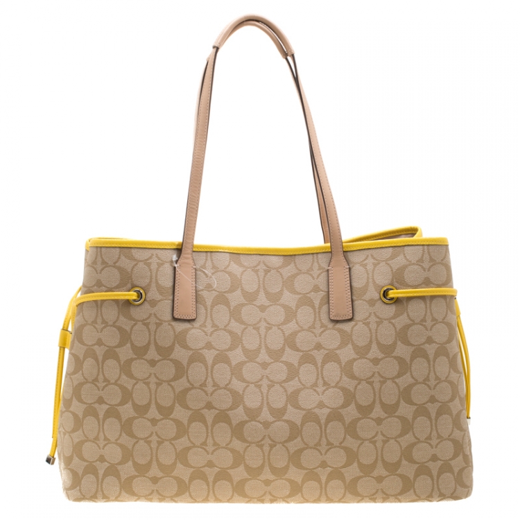 Pre Owned Coach Beige/Yellow Coated Canvas and Leather Large Stripe Drawstring Signature Tote