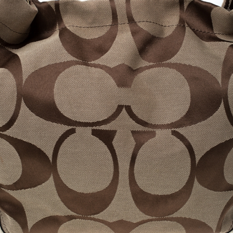 Pre Owned Coach Beige Signature Canvas and Leather Carly Hobo