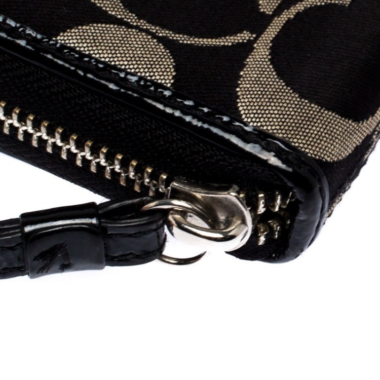 Pre Owned Coach Black/White Signature Fabric and Leather Zip Around Continental Wallet