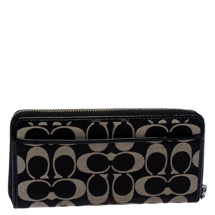 Pre Owned Coach Black/White Signature Fabric and Leather Zip Around Continental Wallet